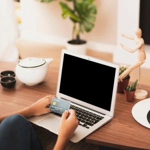 Ecommerce checkout page with payment details on laptop screen for online purchase