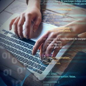 Web developer writing code for website development on laptop screen